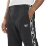 Long Sports Trousers Reebok Ri Tape Black by Reebok, Men - Ref: S64127237, Price: 37,93 €, Discount: %