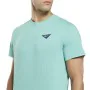 Camisola de Manga Curta Homem Reebok Graphic Les Mills® Água-marinha de Reebok, Homem - Ref: S6486808, Preço: 26,37 €, Descon...